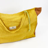 Sac moyen en lin moutarde + <tc>Trousse de Toilette</tc>